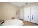 Neutral bedroom with wood floors, white door and large closet offering storage at 12613 Maribou Cir, Orlando, FL 32828