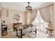 Dining room features modern table with seating, decorative light fixture, and natural light at 12613 Maribou Cir, Orlando, FL 32828