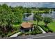 Picturesque gazebo overlooking a serene pond, offering a perfect spot for relaxation and community gatherings at 12613 Maribou Cir, Orlando, FL 32828