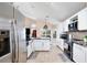 Open kitchen boasts island, modern appliances, and ample counter space at 12613 Maribou Cir, Orlando, FL 32828