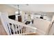 Open-concept living area with staircase leading to kitchen and dining spaces at 12613 Maribou Cir, Orlando, FL 32828