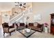 Elegant living room with high ceilings, stylish furniture, and neutral tones creates a sophisticated and welcoming atmosphere at 12613 Maribou Cir, Orlando, FL 32828