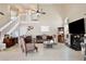 Spacious living room with high ceilings, fireplace, and tile flooring is perfect for entertaining guests and relaxing at 12613 Maribou Cir, Orlando, FL 32828