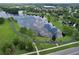 Scenic aerial view of a community pond with walking paths, providing a tranquil setting for residents at 12613 Maribou Cir, Orlando, FL 32828