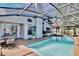Backyard features a sparkling pool and outdoor seating area for relaxation at 12613 Maribou Cir, Orlando, FL 32828