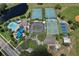 Aerial view of community recreation area with pool, tennis courts, basketball court, playground, and parking at 12613 Maribou Cir, Orlando, FL 32828