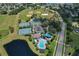 Wide aerial view showcases baseball fields, tennis and basketball courts, pool and recreation center at 12613 Maribou Cir, Orlando, FL 32828