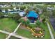 Aerial view of the recreation center featuring a playground, lush landscaping, and community amenities at 12613 Maribou Cir, Orlando, FL 32828