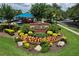 Beautifully landscaped Waterford Lakes Recreation Center sign with colorful flowers and vibrant greenery at 12613 Maribou Cir, Orlando, FL 32828