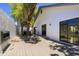 Backyard patio with a white painted exterior and a view of the trees at 1311 Harbour Dr, Longwood, FL 32750