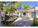 Backyard with a patio, pond, pergola and beautiful landscaping at 1311 Harbour Dr, Longwood, FL 32750