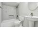 Clean white bathroom featuring modern fixtures, vanity sink, and a shower-tub combo at 1311 Harbour Dr, Longwood, FL 32750