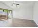 Bright bedroom featuring light wood flooring and a sliding glass door to the outdoor spa at 1311 Harbour Dr, Longwood, FL 32750