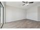 Light-filled bedroom with vaulted ceiling, wood-look flooring, and natural light at 1311 Harbour Dr, Longwood, FL 32750