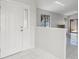 A front entrance showing a white door, large windows, and tile flooring at 1311 Harbour Dr, Longwood, FL 32750