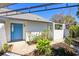 Well-maintained garden featuring a blue door beneath the sun roof at 1311 Harbour Dr, Longwood, FL 32750