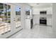 Bright kitchen with stainless steel appliances and a doorway leading to an outdoor patio at 1311 Harbour Dr, Longwood, FL 32750