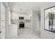 Modern kitchen showcasing white cabinetry, stainless steel appliances, and ample countertop space at 1311 Harbour Dr, Longwood, FL 32750