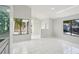 Living room boasts tile flooring, recessed lighting, and a wet bar with glass shelving at 1311 Harbour Dr, Longwood, FL 32750