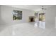 An open living room featuring tile flooring, large windows, and a stone fireplace at 1311 Harbour Dr, Longwood, FL 32750