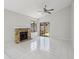 Inviting living room with tile flooring, a stone fireplace, and sliding doors to the patio at 1311 Harbour Dr, Longwood, FL 32750