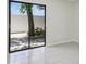 Bright living room featuring sliding glass doors and tile flooring at 1311 Harbour Dr, Longwood, FL 32750