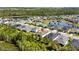 Aerial view of the neighborhood showing community ponds and manicured landscaping at 17668 Passionflower Cir, Clermont, FL 34714
