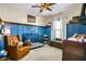 Charming Bedroom with baseball theme and cozy seating at 17668 Passionflower Cir, Clermont, FL 34714