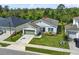 Well-maintained single-Gathering home with landscaped front yard, green lawn and inviting curb appeal at 17668 Passionflower Cir, Clermont, FL 34714