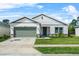 Charming single-Gathering home with a well-manicured lawn and a two-car garage in a quiet neighborhood at 17668 Passionflower Cir, Clermont, FL 34714