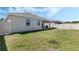 Large backyard with covered patio and privacy fence, perfect for outdoor activities at 1807 Good Neighbor Loop, Kissimmee, FL 34744