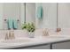Bright bathroom featuring a dual sink vanity with quartz countertop, and modern fixtures at 1807 Good Neighbor Loop, Kissimmee, FL 34744
