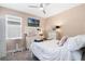Comfortable bedroom with plush carpeting, a ceiling fan, and a wall-mounted TV at 1807 Good Neighbor Loop, Kissimmee, FL 34744
