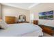 Spacious bedroom with tray ceilings, a tv, and ensuite bathroom access at 1807 Good Neighbor Loop, Kissimmee, FL 34744