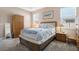 Bedroom with a comfortable bed, side tables, and a large armoire closet at 1807 Good Neighbor Loop, Kissimmee, FL 34744