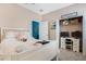 Inviting bedroom with a closet/study nook and a view into an adjacent room at 1807 Good Neighbor Loop, Kissimmee, FL 34744