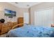Inviting bedroom boasts plush bedding, ample closet space, and warm natural light at 1807 Good Neighbor Loop, Kissimmee, FL 34744