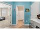 Hallway with a view of the bathroom and living room, showcasing an open layout at 1807 Good Neighbor Loop, Kissimmee, FL 34744