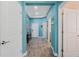 Bright foyer with decorative tray ceiling, wood-look tile flooring and doors to other rooms at 1807 Good Neighbor Loop, Kissimmee, FL 34744