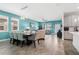 Bright living and dining area featuring stylish decor, tile flooring, and plenty of natural light at 1807 Good Neighbor Loop, Kissimmee, FL 34744