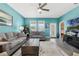 Cozy living room featuring comfortable sofas, a decorative coffee table, and a view of the outdoors at 1807 Good Neighbor Loop, Kissimmee, FL 34744