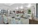 Open clubhouse area featuring comfortable seating and a view of the kitchen and dining areas at 1807 Good Neighbor Loop, Kissimmee, FL 34744