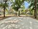 Community basketball court for Gathering enjoyment, surrounded by mature trees and green space at 2014 Applegate Dr, Ocoee, FL 34761