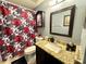 Bathroom with granite countertop, updated sink and cabinet with custom shower curtain at 2014 Applegate Dr, Ocoee, FL 34761