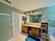 Bathroom vanity with double sinks, granite countertop, tile floors and ample cabinet space at 2014 Applegate Dr, Ocoee, FL 34761