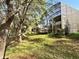 Stunning screened enclosure with lush landscaping, providing privacy and a seamless indoor-outdoor living experience at 2014 Applegate Dr, Ocoee, FL 34761