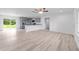 Spacious open floor plan with sleek floors, light gray cabinets, and access to the backyard at 20661 Sw Marine Blvd, Dunnellon, FL 34431