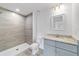 Bathroom featuring tiled standing shower, gray vanity and recessed lighting at 21145 Sw Great Lakes Blvd, Dunnellon, FL 34431