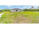 Home showcasing the expansive yard with lush grass, ideal for outdoor activities and enjoying nature at 21145 Sw Great Lakes Blvd, Dunnellon, FL 34431