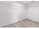 Walk-in closet with shelving and wood-look floors at 21145 Sw Great Lakes Blvd, Dunnellon, FL 34431